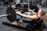 Hip thrusts in a leg day workout (Image via Getty Images)